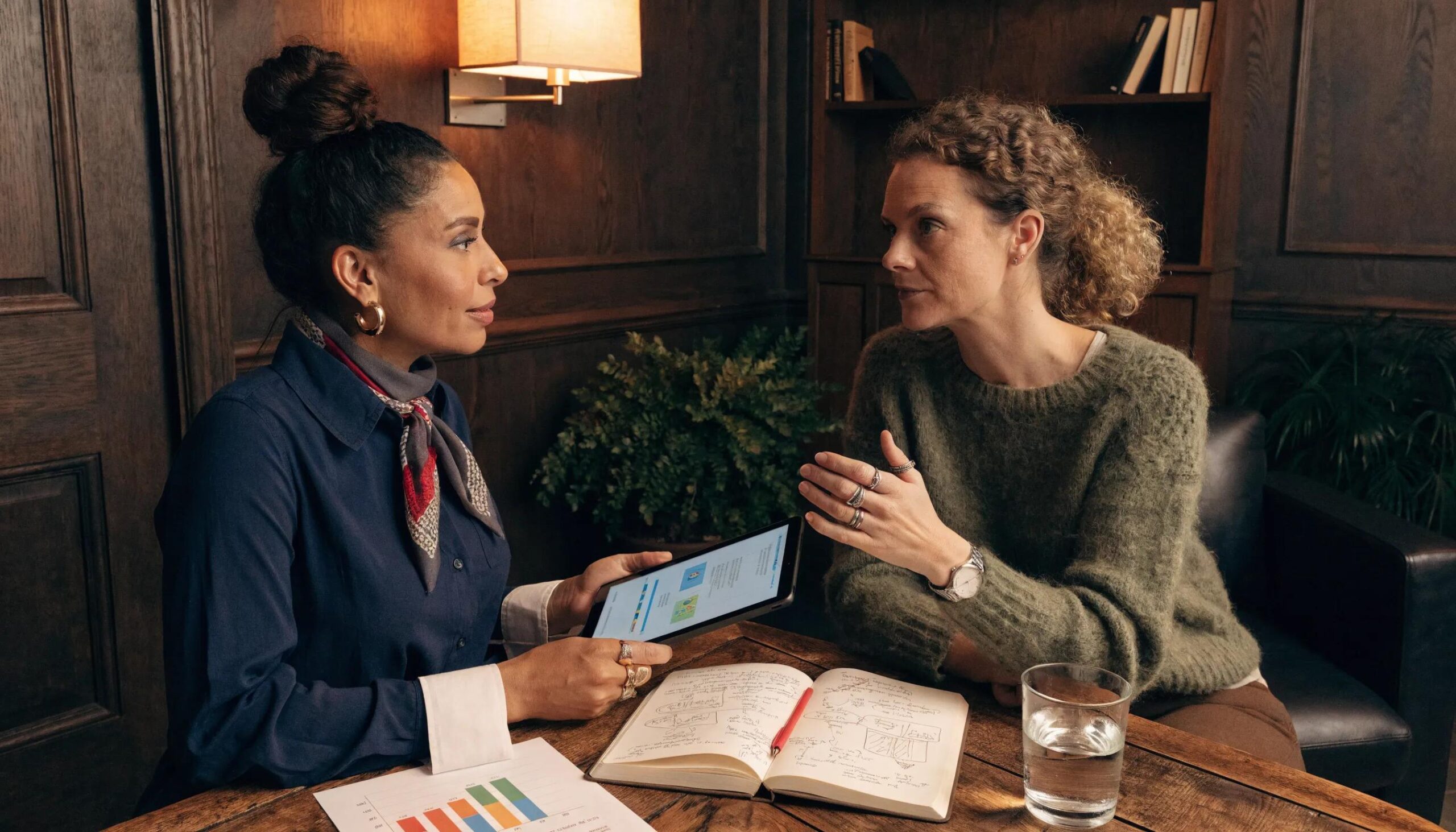 Benefits broker consulting with a small business owner about tailored benefits plans