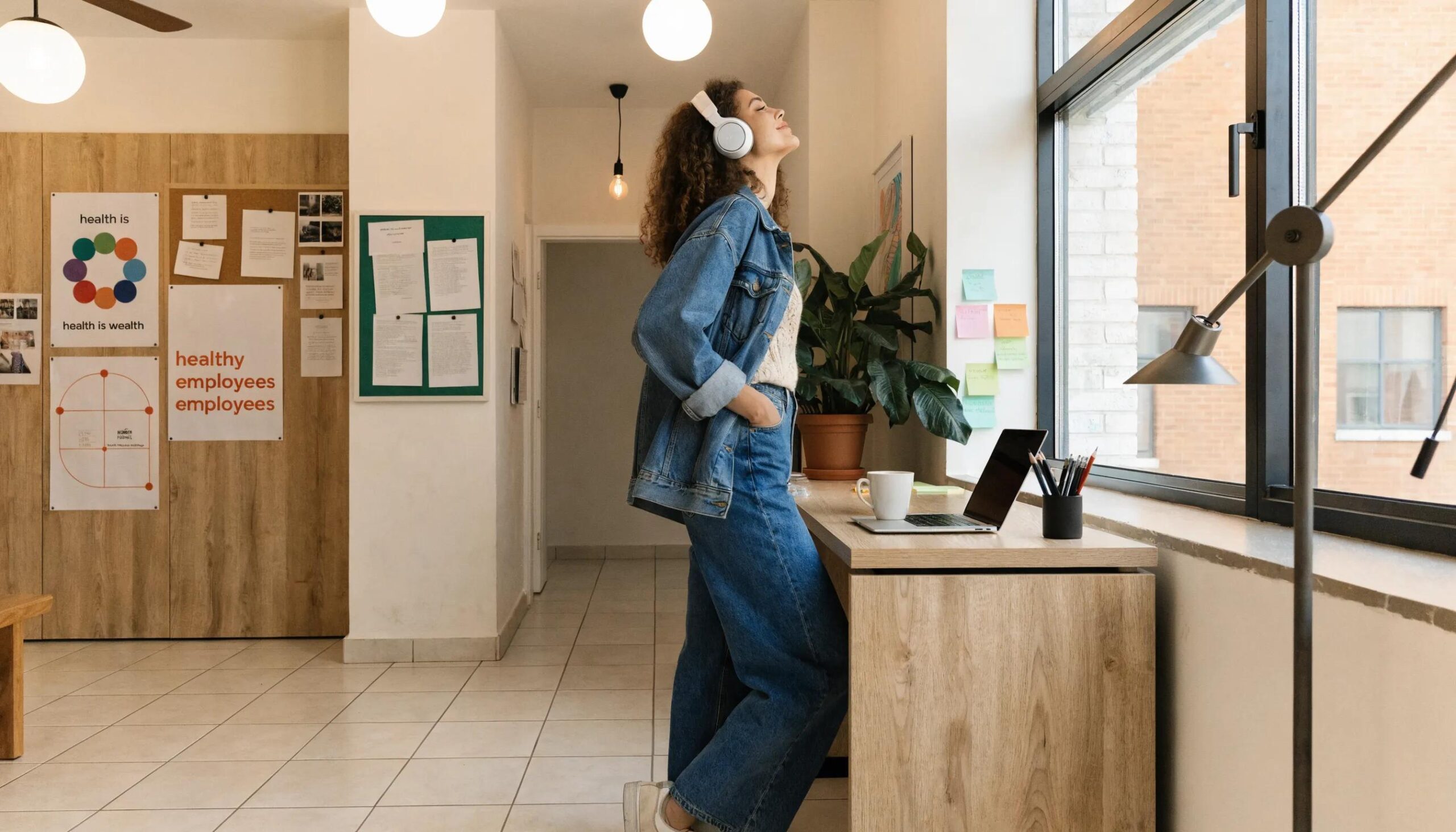 Happy employee in a serene workspace representing well-being and job satisfaction
